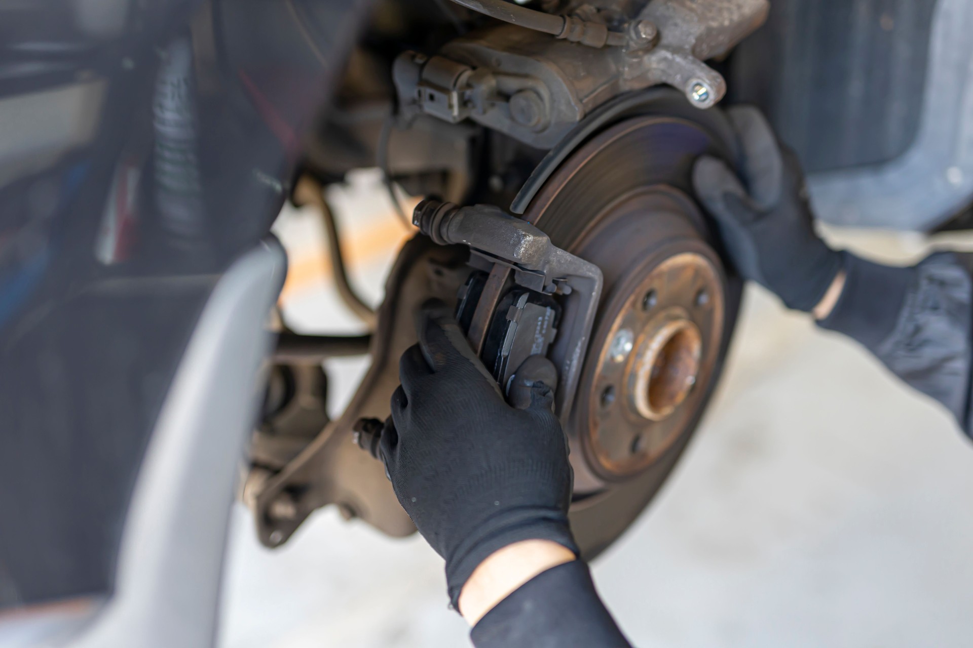 Brake pad and tire change at auto repair shop